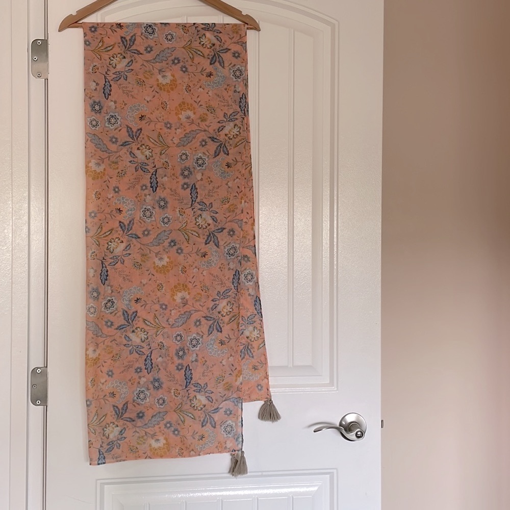 Light weight scarf with floral pattern.